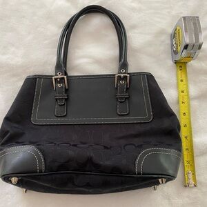 Coach Black Tote Bag with Structured Handles and Sleek Design